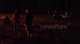 Man drives through bonfire