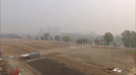 DRONE VIDEO November 15 2018 11AM THE CAMP FIRE, PARIDISE, CALIFORNIA, BUTTE COUNTY.  Raw drone video obtained from West Sacramento near the Sacramento River of downtown Sacramento and the Capital buildings and bridges. Visibility was less then minimums g