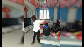 Wedding prepper makes balloons stick in place by rubbing them on her brother's head