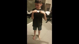 Adorable rescue cat 'planks' when human brother scratches its tummy