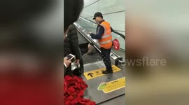 Airport crews rescue man trapped neck-deep in escalator