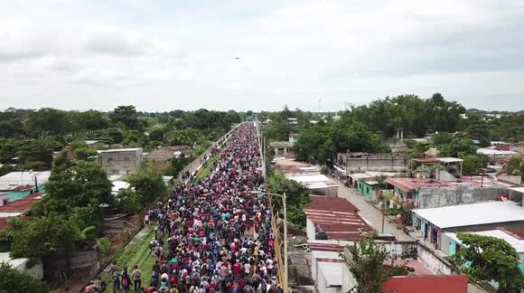Drone footage shows caravan of migrants heading for Mexico - Buy, Sell ...