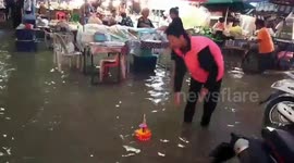 Thai water lantern festival continues even in flooded communities