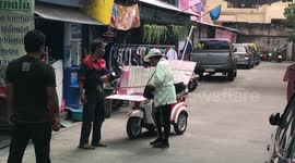 Old Lady Selling Lottery Tickets From Mobility Scooter