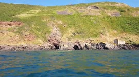 Kayaking in to a cave near plymouth Devon