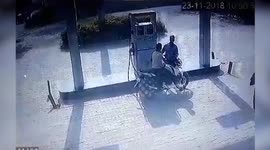 Two men escape death after a tractor dashes against a petrol dispenser at a petrol pump in Uttar Pradesh, India