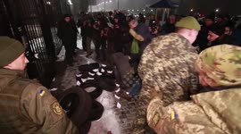 Protestors hurl flares, set tires on fire outside Russia embassy in Kiev