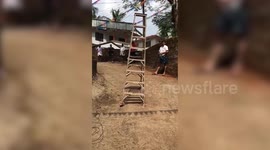 Bizarre moment when a ladder was filmed walking on the ground on its own in Kerala, India