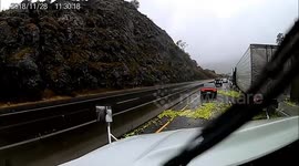 Truck crashes spectacularly in California, spilling cargo over road