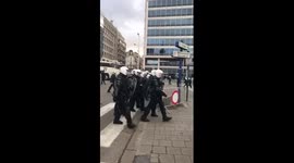 Belgian riot police storm through the city in order to defuse clashes