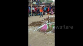 Daredevil breaks glass tube lights on his body and with his teeth