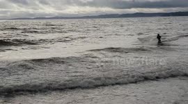 Jet ski playing on the waves in Exmouth.