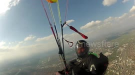 Over the city with paraglider