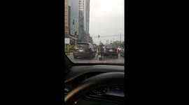 Fed up pedestrian clambers along power lines to cross busy road