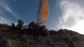 Paragliders tries top landing and falls