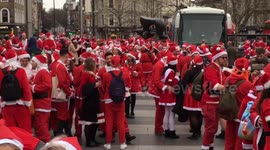 Dozens of Santas gather at Kings Cross for SantaCon