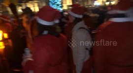 Santas take over London's Trafalgar Square for SantaCon