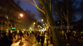 Paris riots: Demonstrators fleeing tear gas and breaking everything in their path