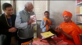 Morgan Freeman is blessed by a holy man in Nepal