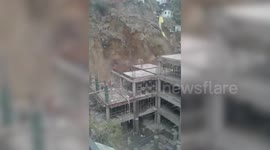 Scary moment workers flee as landslide swallows homes