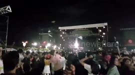 Angry revellers hurl water bottles at stage when Christmas concert is cancelled