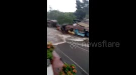 Driver almost makes wrong turn into immense floodwater in Indonesia