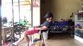 Hilarious footage shows sleepy man falling off chair in Philippines