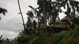 Chinese man screaming hilariously on a mountain swing in Bali