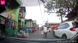 Kid playing in the street hits head on car.