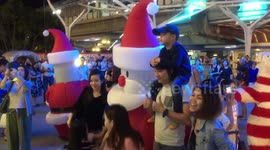 Xmas characters mix with shoppers in Bangkok Thailand