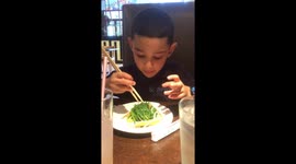 Boy eating seaweed salad