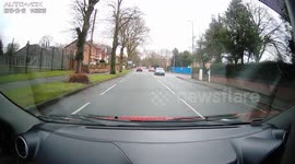 Lady trips over leaving drive way caught on dash cam