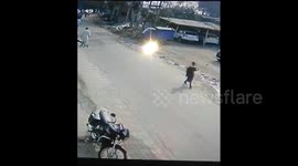 Cyclist makes perfect two-footed landing after colliding with truck