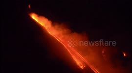 Footage shows smoke and lava flows from erupting Mt Etna