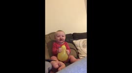 Baby gets mad chewing on a balloon