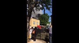 Grenfell tower seen burning as crowds of terrified onlookers gather