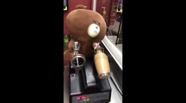 Teddy bear shaking milk bottles