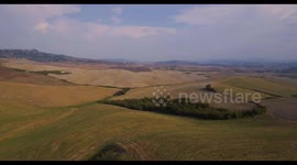 Aerial, gorgeous tuscan fields landscape near the city of Volterra