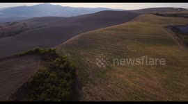 Aerial, gorgeous tuscan fields landscape near the city of Volterra