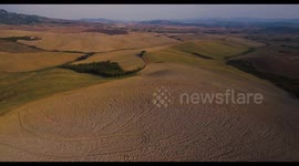 Aerial, gorgeous tuscan fields landscape near the city of Volterra