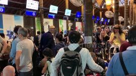 Chaos in Thai airport as stranded tourists rush to leave islands