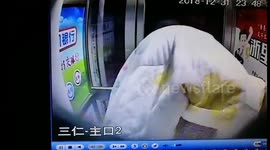 Alleged scammer scrambles out of ATM after being scared by staff's voice