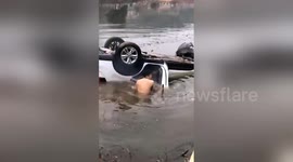 Man saves father and daughter trapped in car after vehicle loses control and dives into pond in southern China