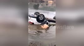 Man saves father and daughter trapped in car after vehicle loses control and dives into pond in southern China