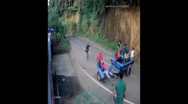 Overloaded mini tractor loses control, spins 16 times before plunging off the road and missing an oncoming bus by a whisker in Sri Lanka