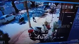 Lucky bike rider goes under a truck and comes out alive