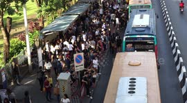 A very busy bus stop in Bangkok, Thailand.
