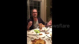 Cat crashes dinner party, licks food then gleefully runs away