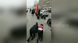 Chinese employees crawl along road as punishment for not reaching target