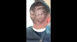 Barber shaves boxers Manny Pacquiao and Adrien Broner into customer's hair